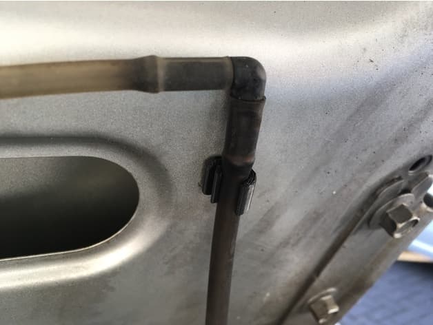 Mazda bongo wiper fluid hose clip - image